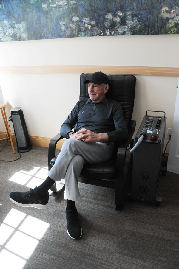 Dr Caprio contemplates in the PEMF chair